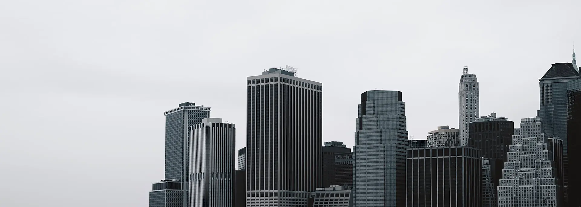 city buildings under white sky during daytime